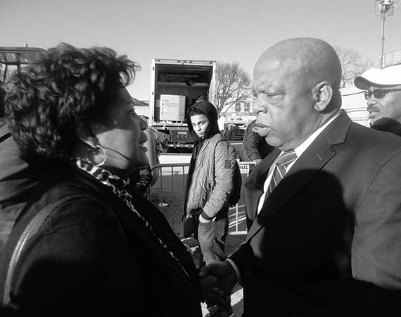 Reena Evers-Everette shaking the hand of Congressman John Lweis.